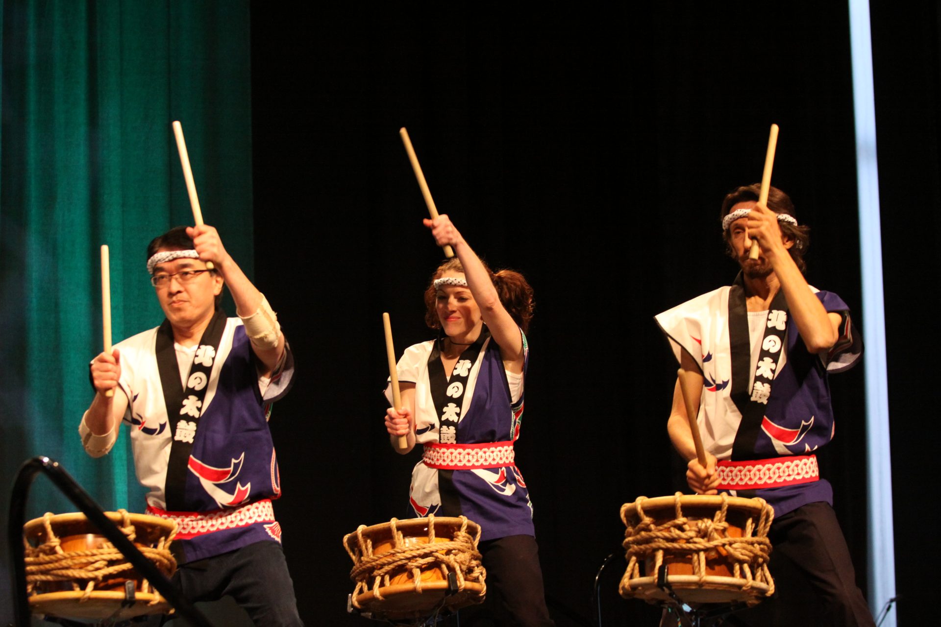 Three professional drummers on stage at ICLEI 2009 performing for the attendees.