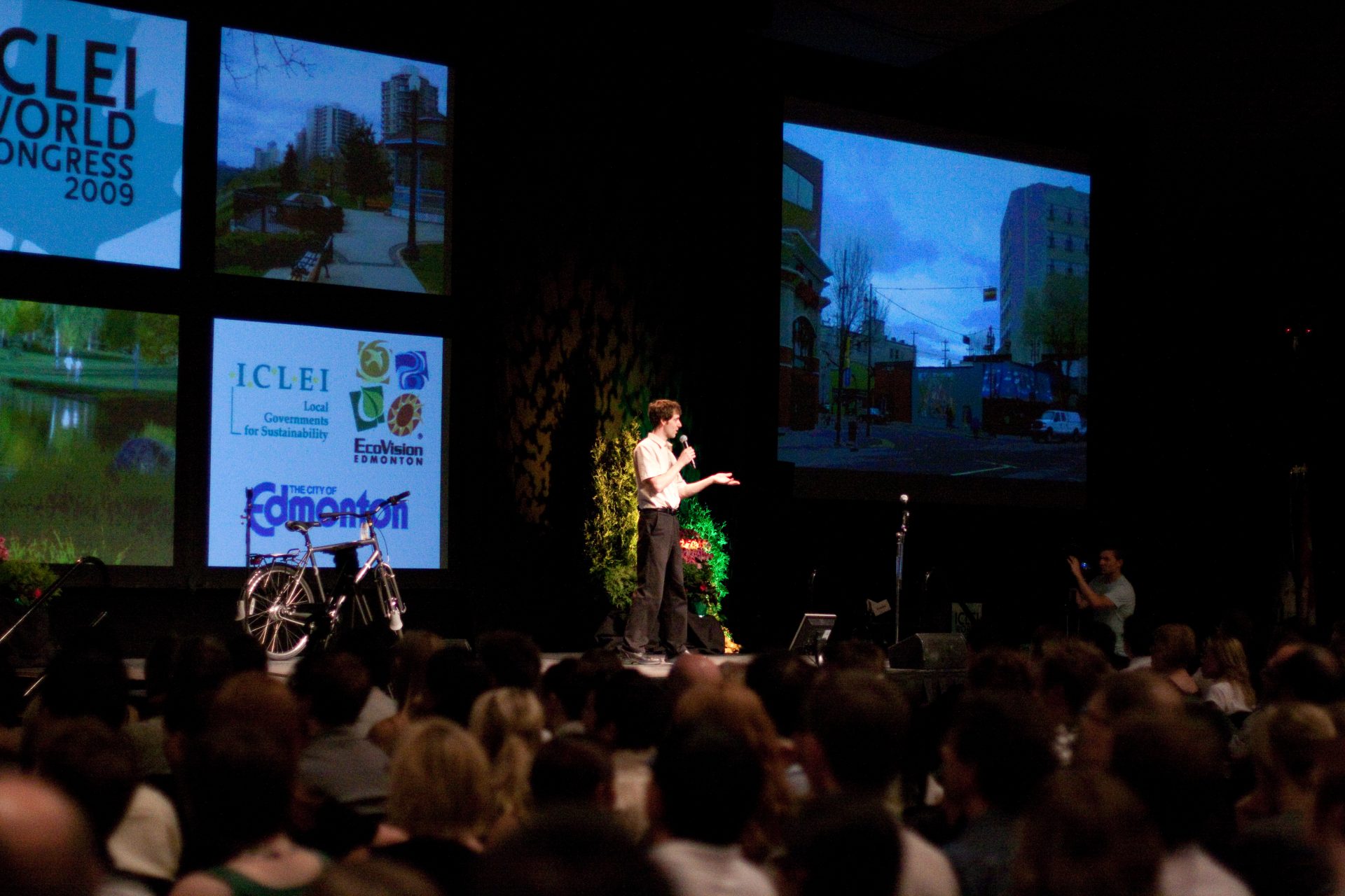 A knowledgeable professional on stage at ICLEI World Congress 2009 speaking to a large audience.